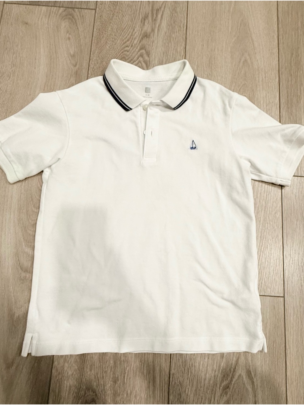 Uniqlo White Polo with Navy Trim and Sailboat Embroidery